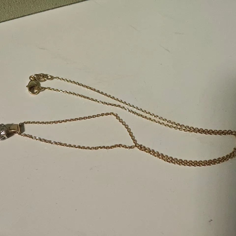 18CT GOLD PENDANT ON CHAIN SET WITH A NATURAL DIAMOND WEIGHING +-1.02CT