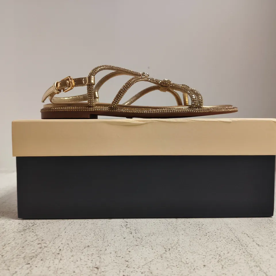 BOXED PAIR OF KURT GEIGER ROONIE OPEN TOE FLAT SANDALS IN GOLD W. JEWEL DETAIL SIZE EU 37
