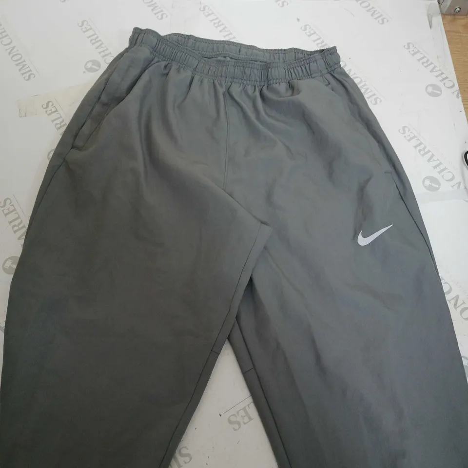 NIKE DRI FIT KHAKI PANTS -  M 