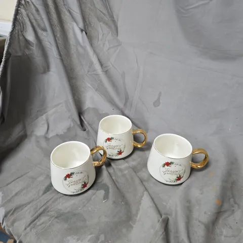 SET OF 3 WHITE CERAMIC CHRISTMAS MUGS WITH GOLD HANDLES – SEASON'S GREETINGS