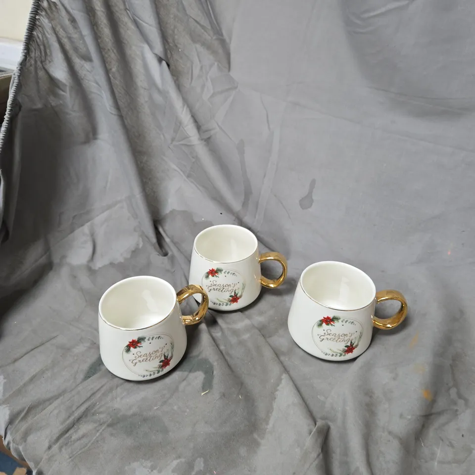 SET OF 3 WHITE CERAMIC CHRISTMAS MUGS WITH GOLD HANDLES – SEASON'S GREETINGS