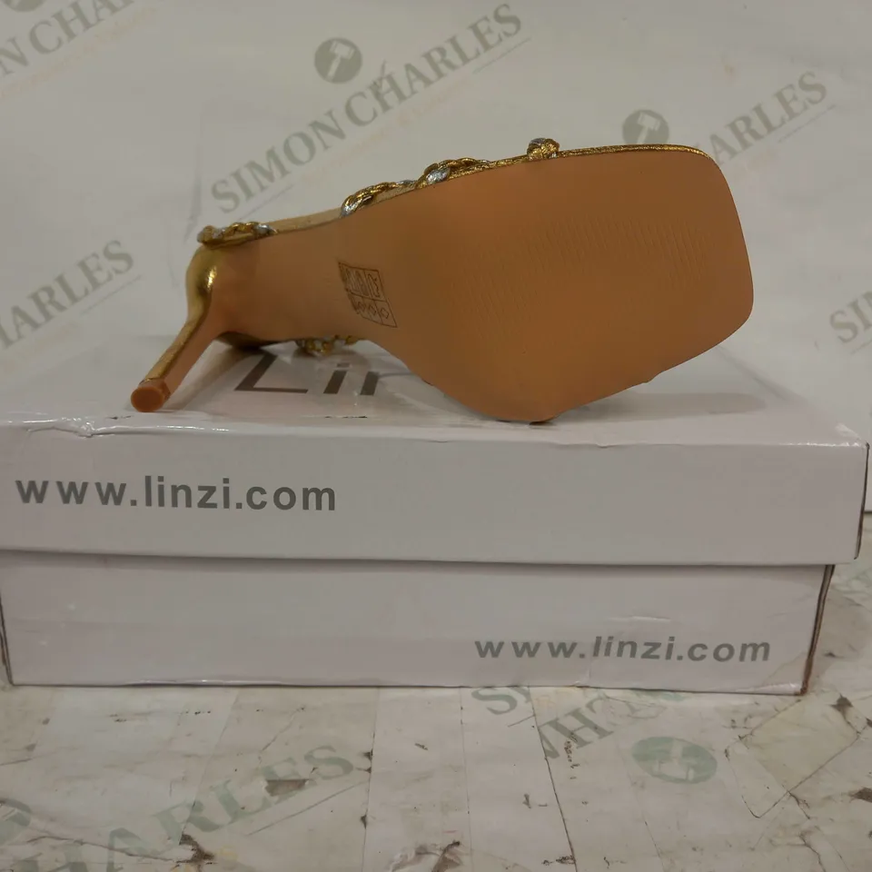 BOXED PAIR OF LINZI OPEN TOE WOVEN STRAPPY HIGH HEEL SANDALS IN METALLIC GOLD COLOUR SIZE 5