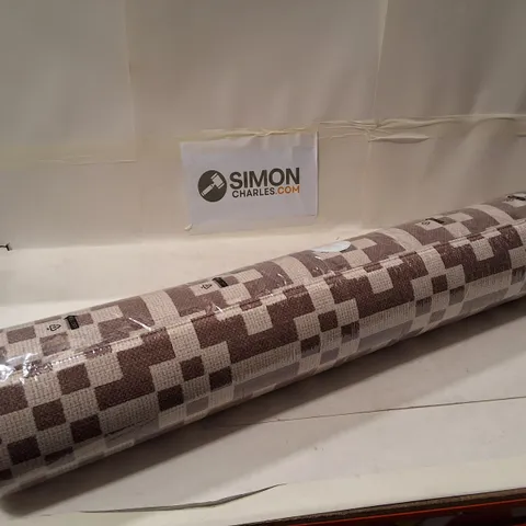 GEOMETRIC PATTERNED RUG β BROWN & BEIGE, ROLLED IN PLASTIC WRAP