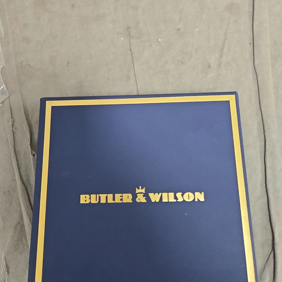 BUTLER & WILSON BRACELET WITH BLACK STONES AND CRYSTAL ROSE CENTERPIECE