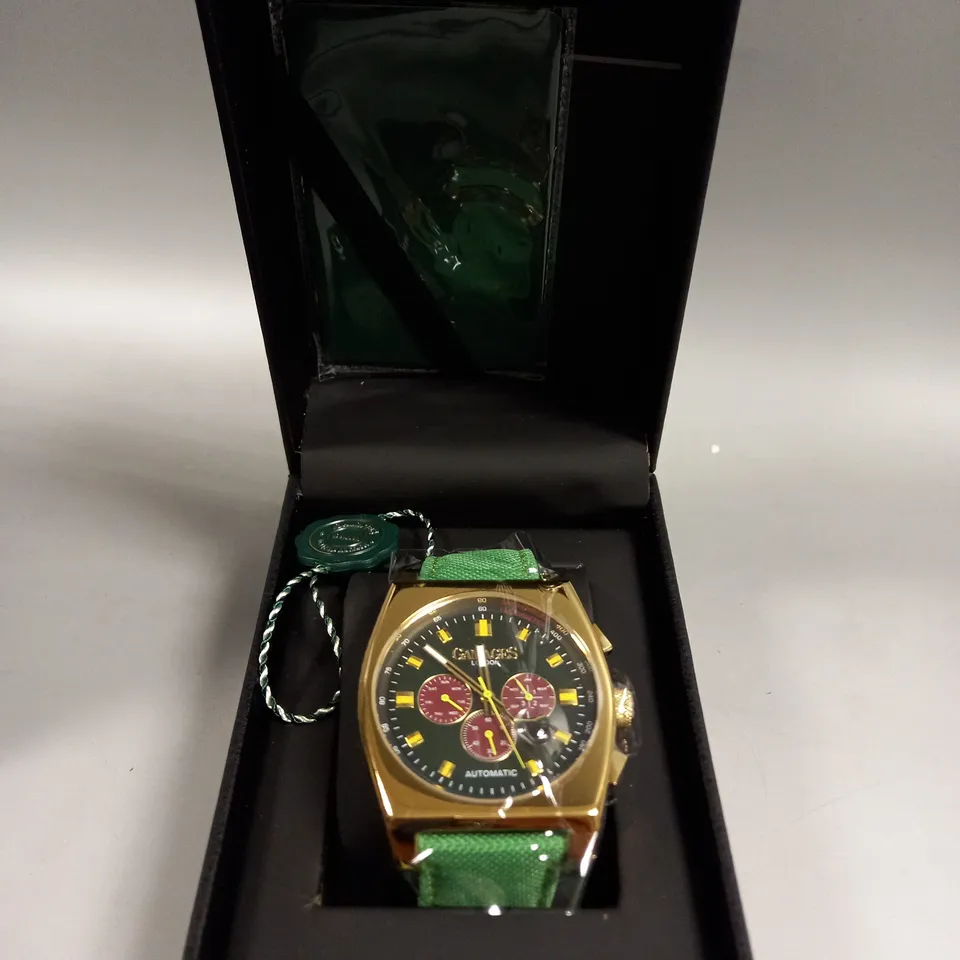 BOXED GAMAGES RETRO CALIBRE GOLD/GREEN WATCH