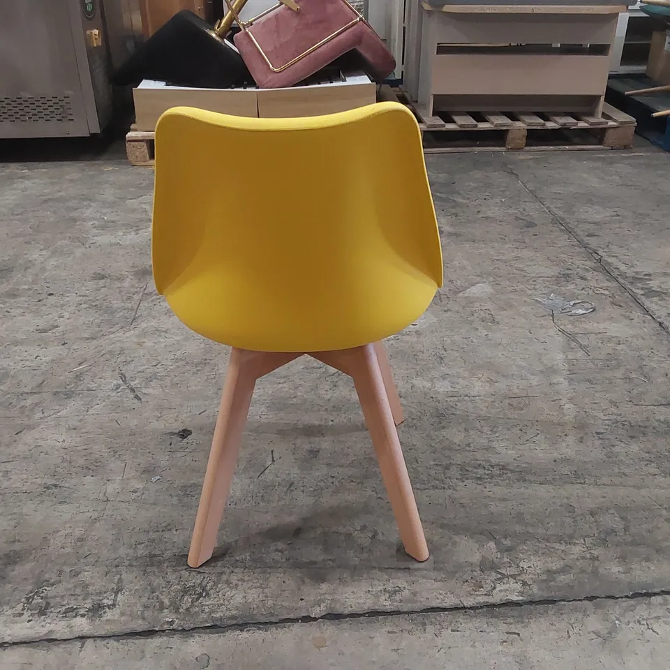 DESIGNER YELLOW PLASTIC DINING CHAIR WITH PADDED SEAT