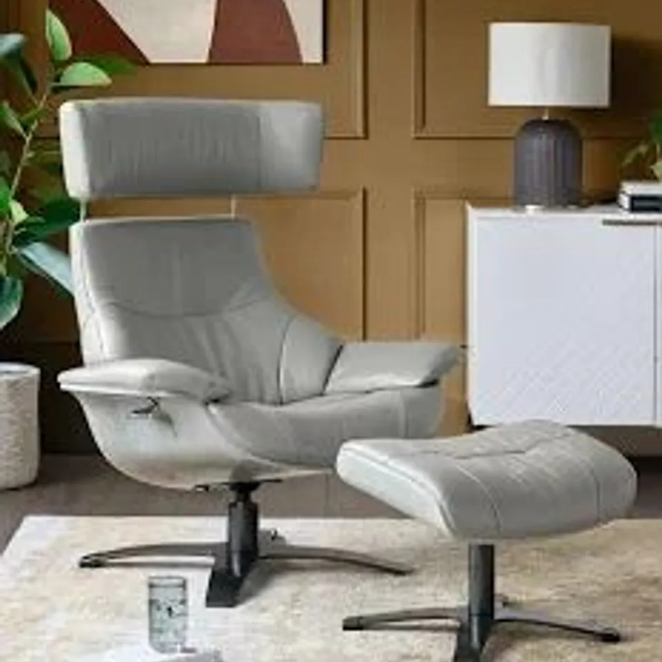 BOXED KARMA WHITE LEATHER RECLINING ARMCHAIR AND FOOTSTOOL (4 BOXES)