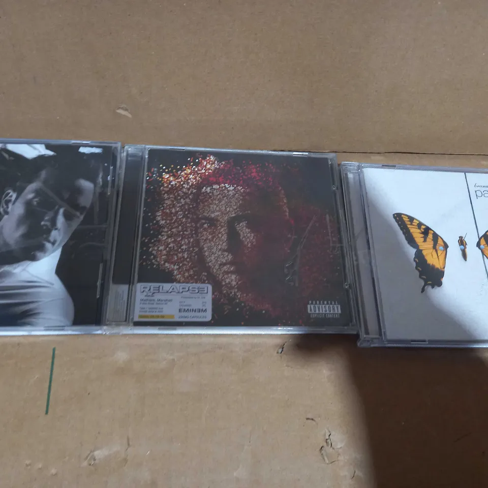 BOX OF APPROXIMATELY 20 ASSORTED CDS AND DVDS TO INCLUDE ROBBIE WILLIAMS GREATEST HITS, EMINEM RELAPSE, PARAMORE BRAND NEW EYES, ETC