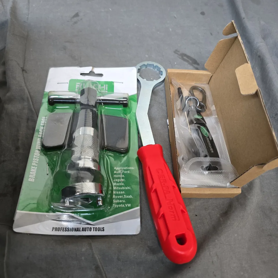 box of assorted car items to include - land rover key ring - tools - exhaust sealant 