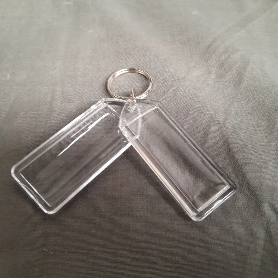 LOT OF 8 MULTIPACK BAGS OF CLEAR KEYRINGS