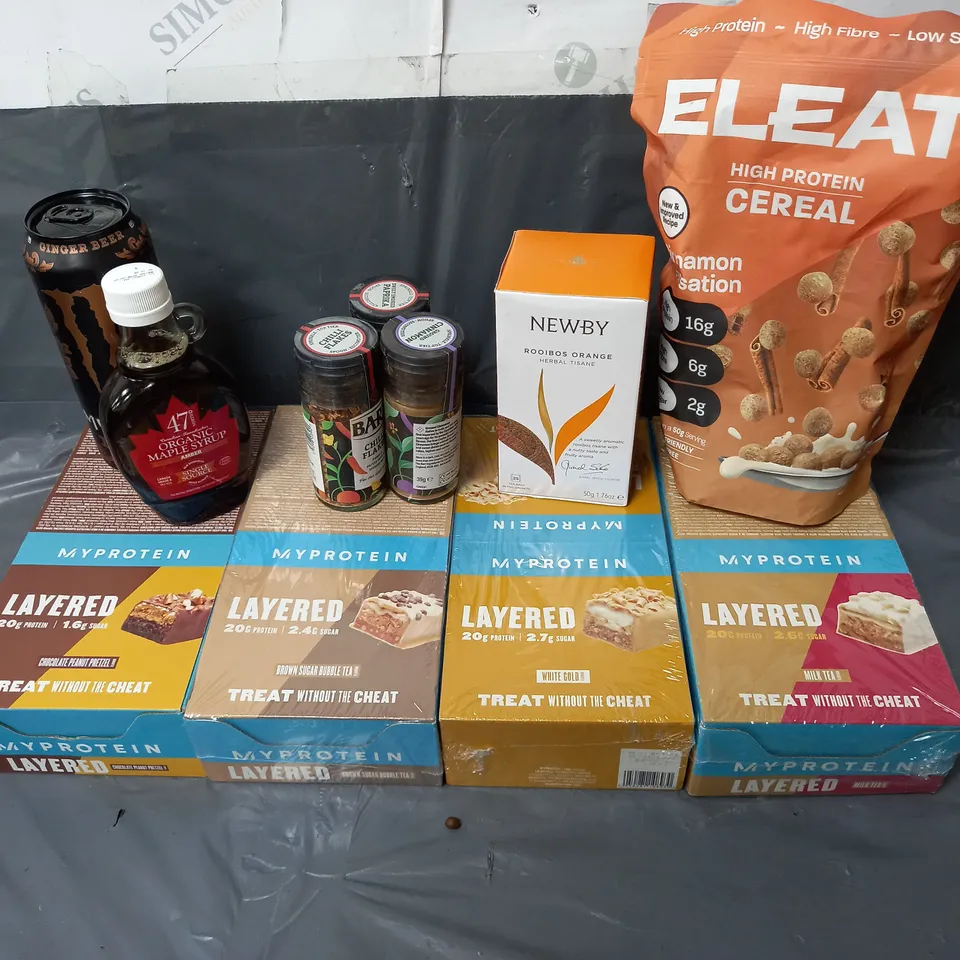 APPROXIMATELY 10 ASSORTED FOOD & DRINK ITEMS TO INCLUDE - MYPROTEIN LAYERED PROTEIN BARS - ELEAT PROTEIN CEREAL CINNAMON SENSATION - 47 NORTHO ORGANIC MAPLE SYRUP - ETC