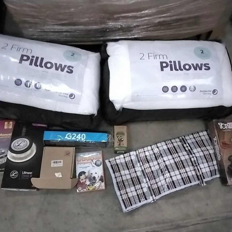 PALLET OF ASSORTED ITEMS INCLUDING PREMIER INN 2 FIRM PILLOWS, ODDBALL AND THE PENGUINS, TORTILLADA CAST IRON TORTILLA PRESS, HACKS FOR FORTNITERS, CLIFFORD THE BIG RAD DOG, DURACELL 6 C BATTERIES, 
