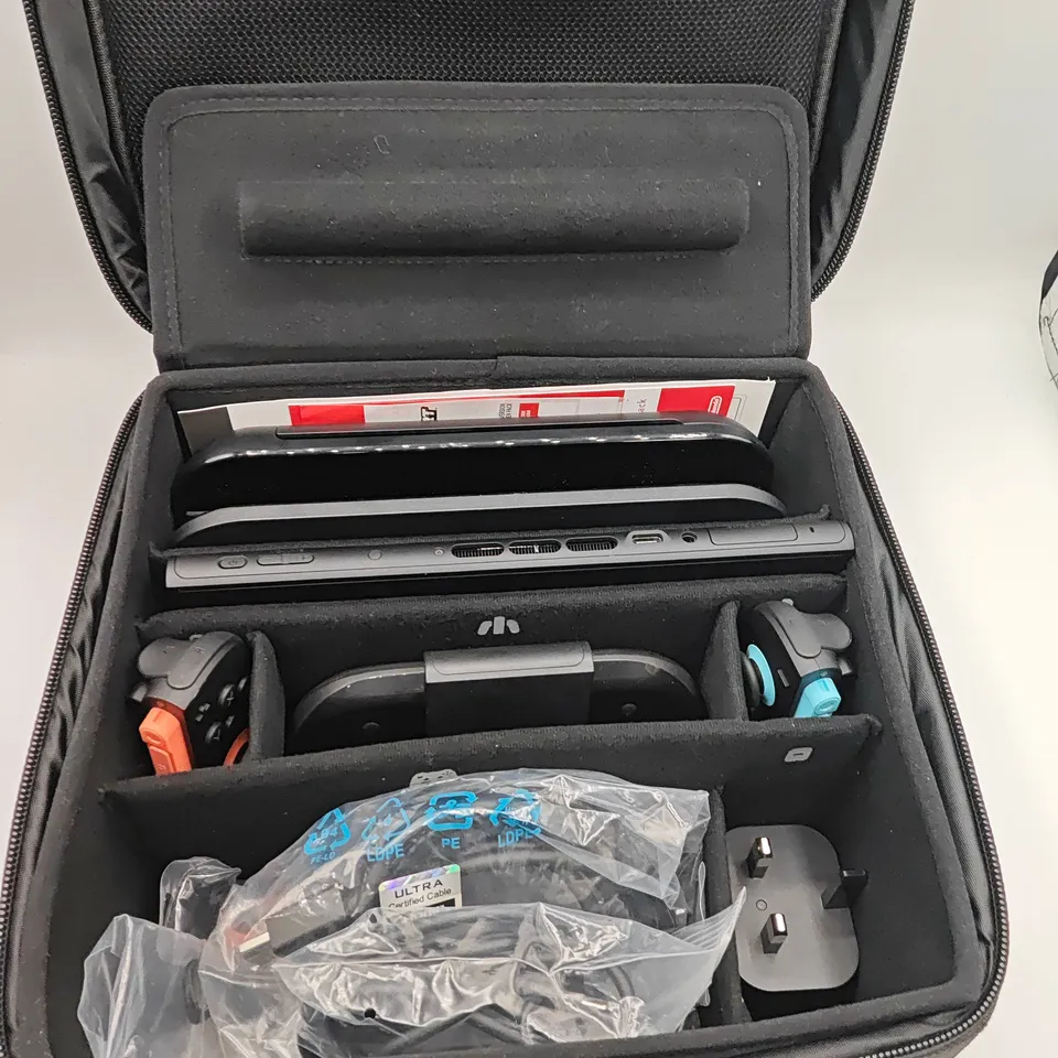 NINTENDO SWITCH 2 HANDHELD GAMES CONSOLE WITH ACCESSORIES AND ALL-IN-ONE CARRY CASE AND 1 GAME