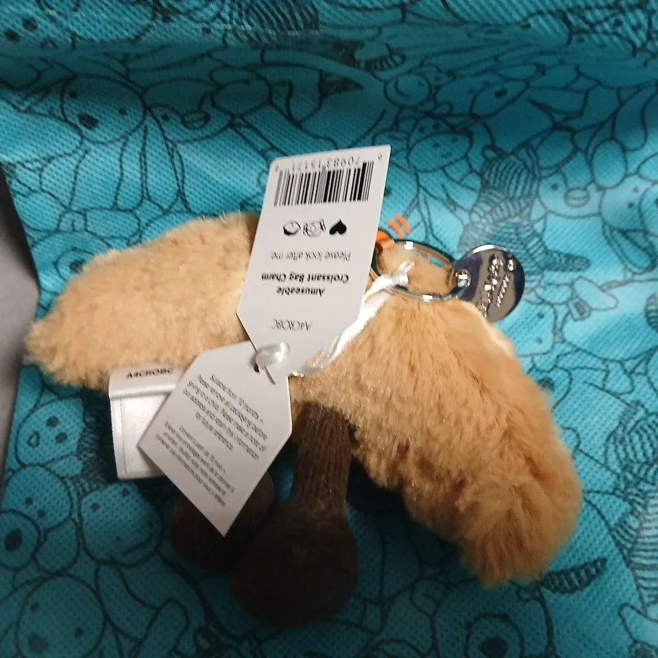 JELLYCAT LONDON PLUSH TOY – BEIGE FLUFFY ANIMAL WITH BROWN FEET