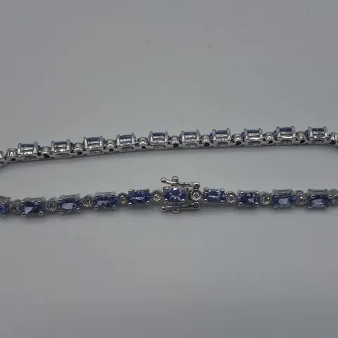 WHITE GOLD BRACELET SET WITH OVAL CUT TANZANITES AND NATURAL DIAMONDS WEIGHING +-6.11CT