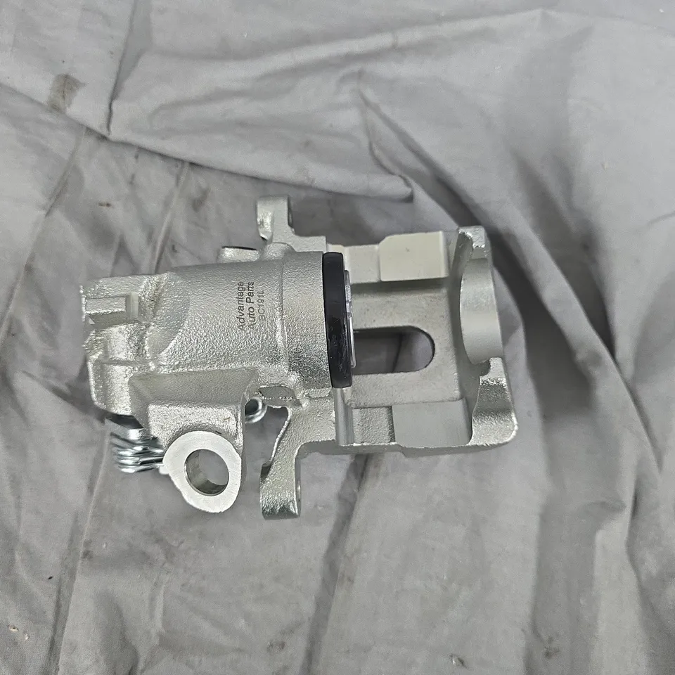 BRAKE CALIPER HOUSING – SILVER CAST METAL (VEHICLE PART)