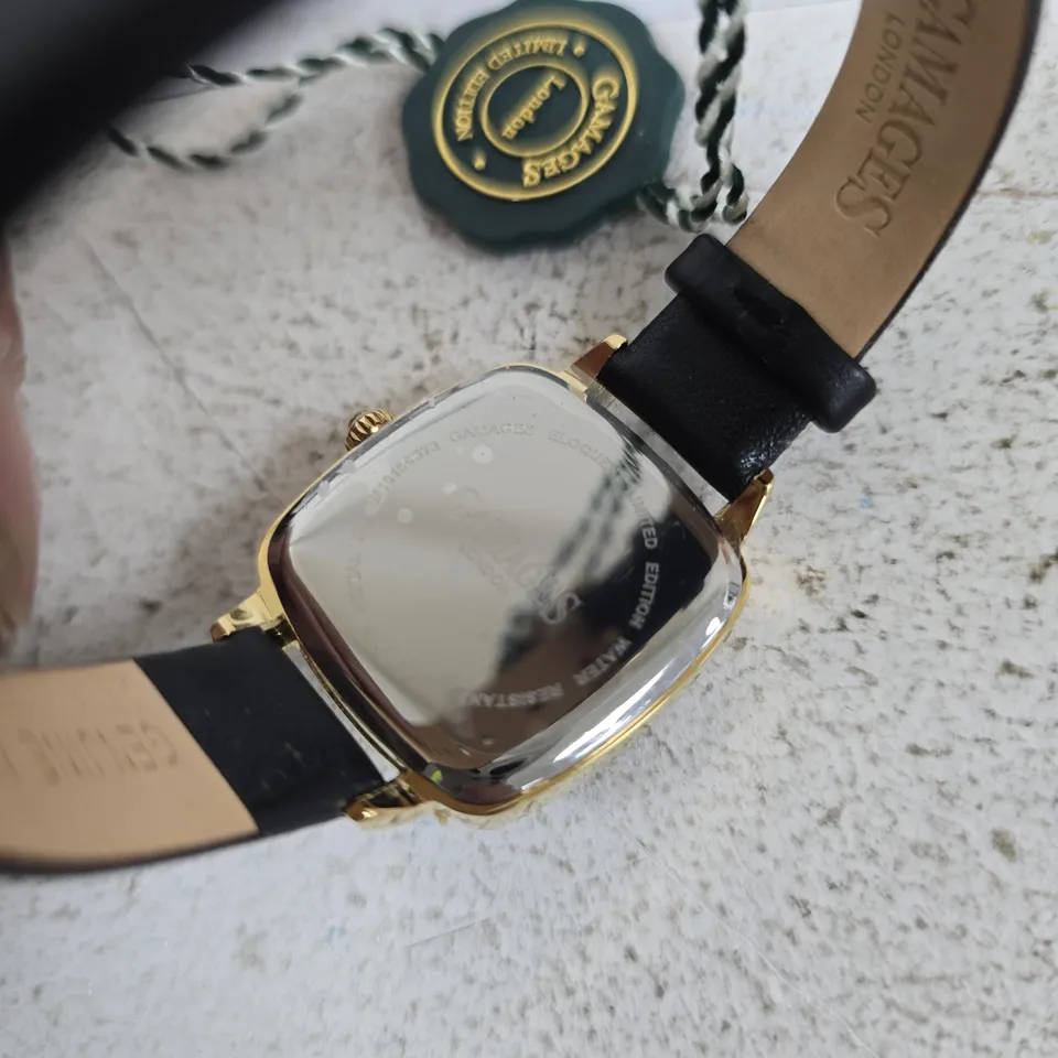 GAMAGES LONDON GOLD-TONE WRISTWATCH WITH BLACK DIAL AND LEATHER STRAP
