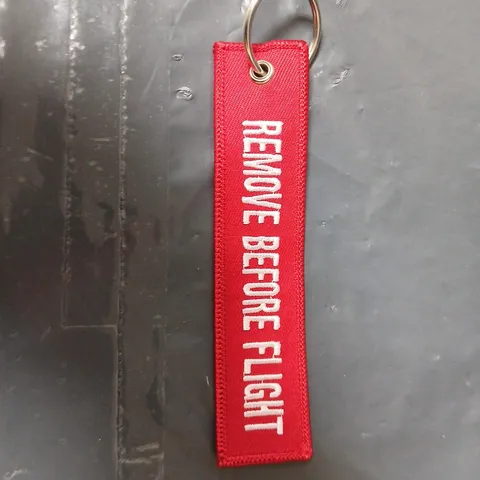 APPROXIMATELY 20 RED REMOVE BEFORE FLIGHT KEY CHAINS – TAKEOFF TV BULK PACK