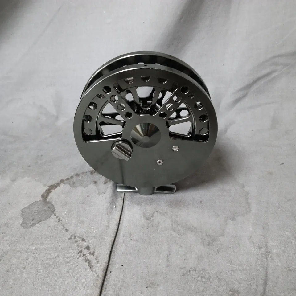 FLY FISHING REEL WITH PERFORATED SPOOL AND WOODEN KNOB HANDLES IN BLACK POUCH