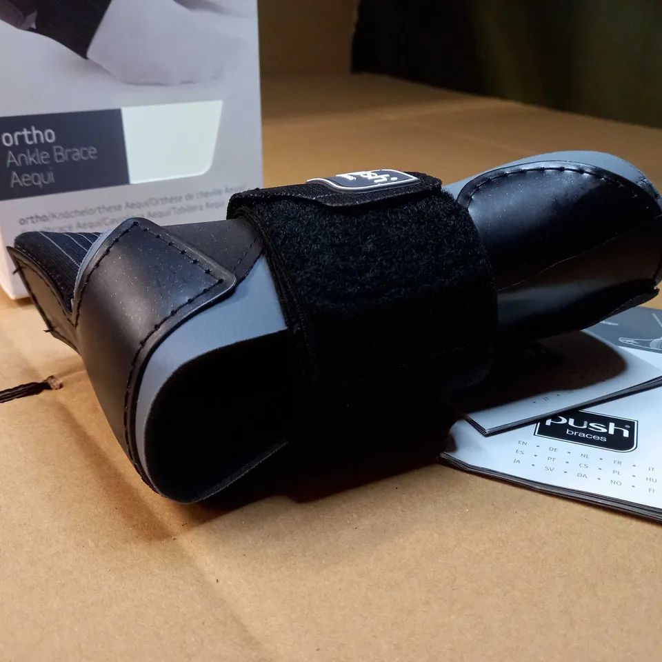 BOXED PUSH ORTHO BLACK LEFT ANKLE BRACE - SIZE 1
