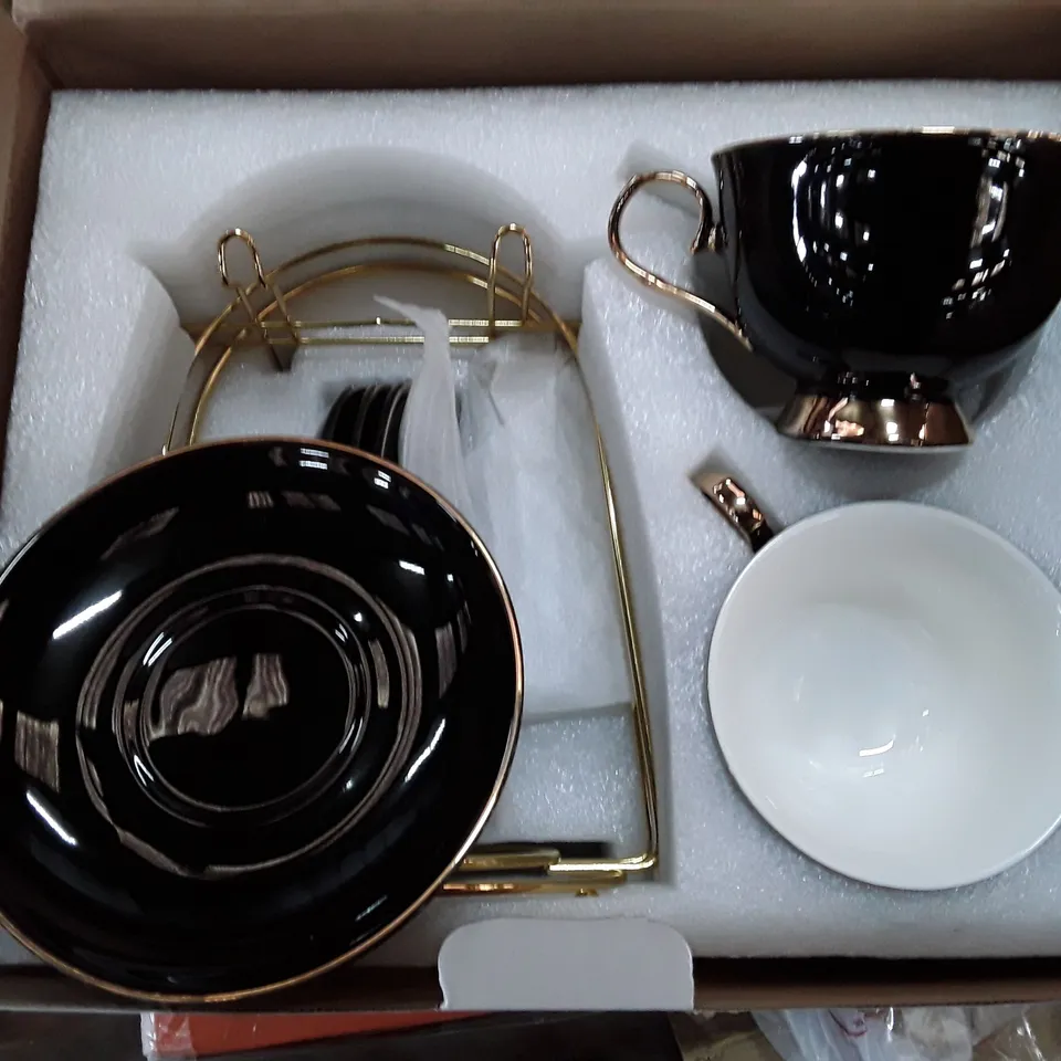 BOXED DUJUSY 4-PIECE CUP AND SAUCER SET