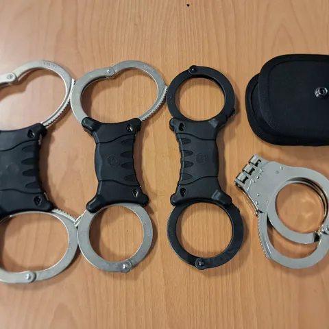 LOT OF 4 SETS OF HAND CUFFS - NO KEYS