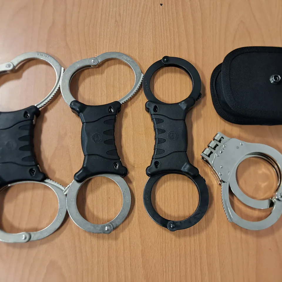 LOT OF 4 SETS OF HAND CUFFS - NO KEYS