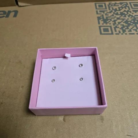 SWAROVSKI BOXED SET OF FOUR CLEAR ROUND STONE STUD EARRINGS IN PINK PRESENTATION BOX