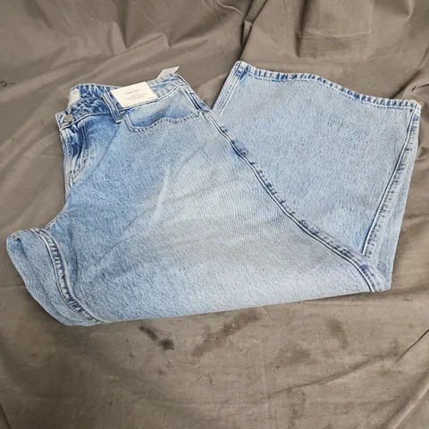 HOLLISTER LOW RISE BAGGY FLARE JEANS IN LIGHT BLUE SIZE W32 SHORT