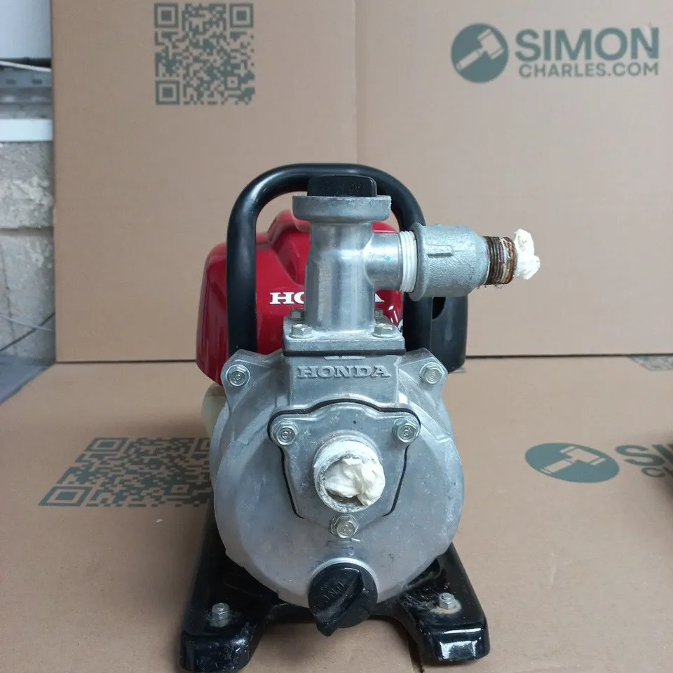 HONDA WX10 1-INCH PETROL-POWERED WATER PUMP DESIGNED FOR AGRICULTURAL, GARDEN, OR DOMESTIC WATER TRANSFER.