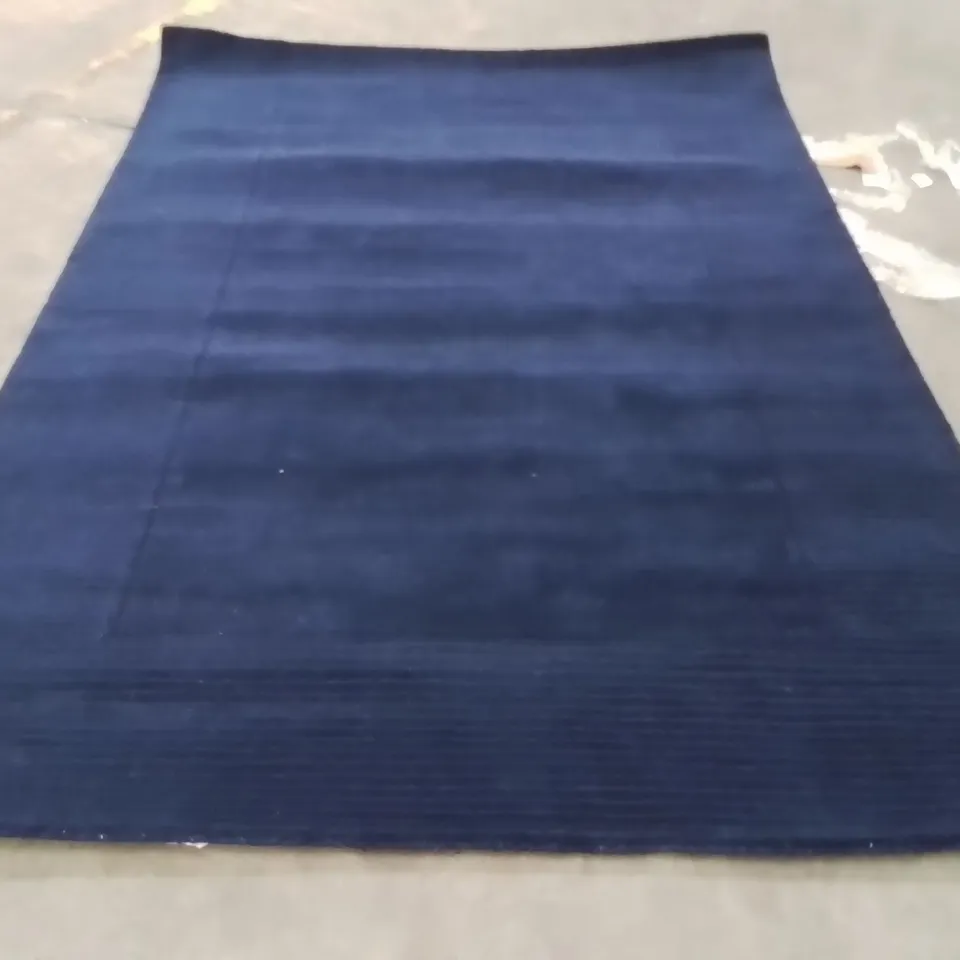 STILLAGE OF APPROXIMATELY 20 QUALITY DESIGNER RUGS