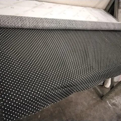 ROLL OF BLACK DOTTED FABRIC 