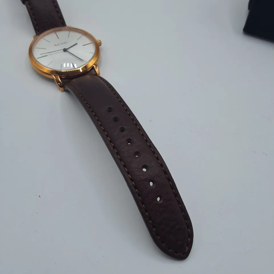 BOXED PAUL SMITH STAINLESS STEEL WATCH WITH JAPANESE MOVEMENT AND BROWN LEATHER STRAP