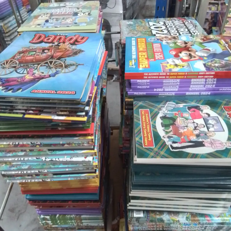 CAGE OF ASSORTED 2024 ANNUALS TO INCLUDE BLUEY, SUPER NARROW, DANDY AND GUINESS RECORDS 