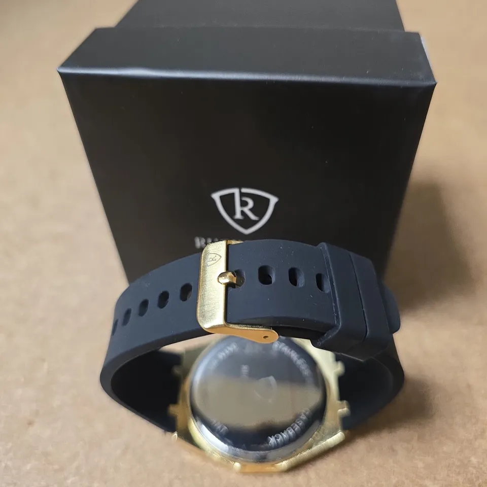 RUCKSTUHL GOLD-TONE WRISTWATCH WITH BLUE RUBBER STRAP – BOXED