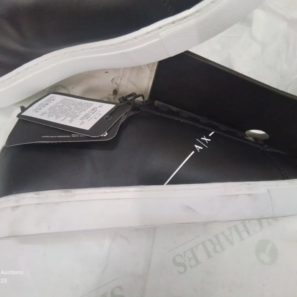 BOXED PAIR OF ARMANI EXCHANGE SIZE NINE BLACK TRAINERS.