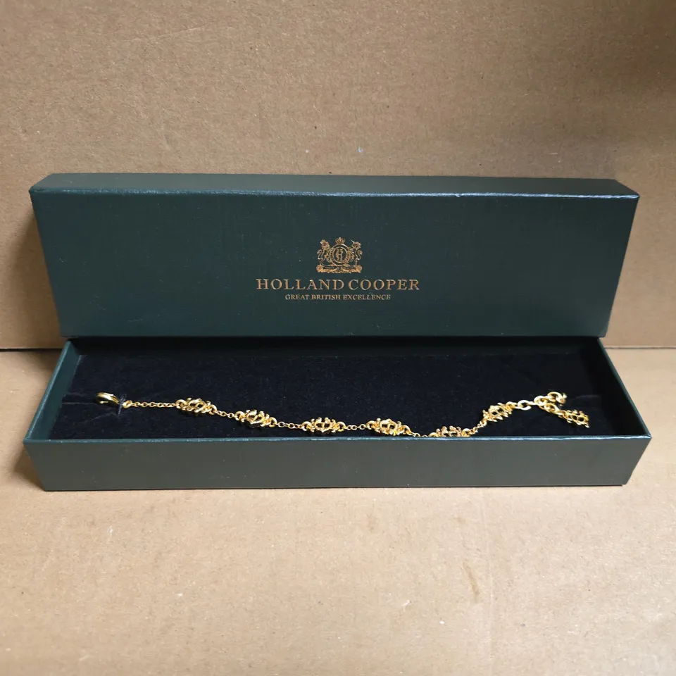 BOXED HOLLAND COOPER FONE HERALDIC HC BRACELET IN VINTAGE GOLD COLOUR