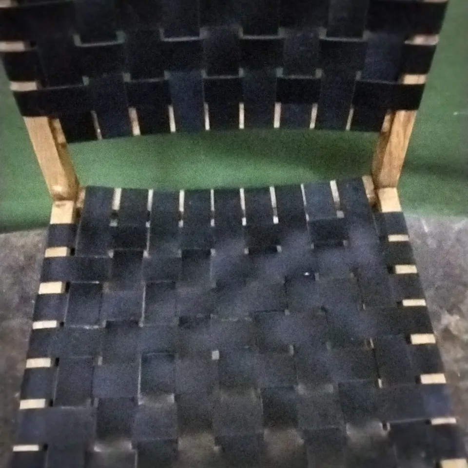 SIX DESIGNER WOODEN FRAMED DINING CHAIRS WITH BLACK WEAVED LEATHER SEAT AND BACK PADS AND STUDDED DETAIL