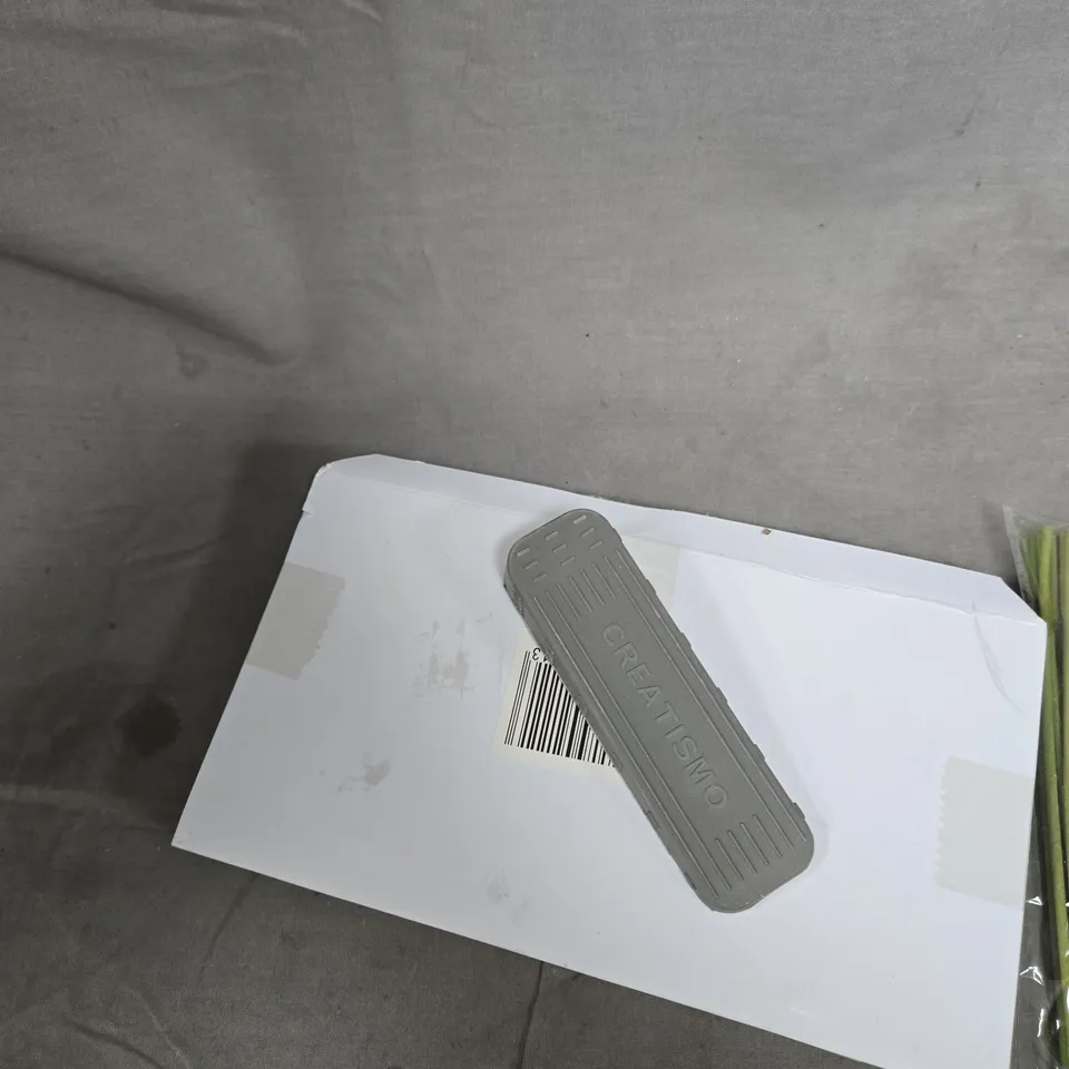 TOTE OF APPROXIMATELY 12 ASSORTED ITEMS TO INCLUDE: INCENSE STICKS AND DOOR STOPPERS 