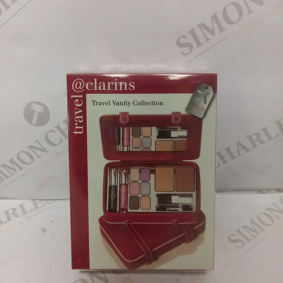 BOX OF APPROX 11 SEALED CLARINS TRAVEL VANITY COLLECTION 