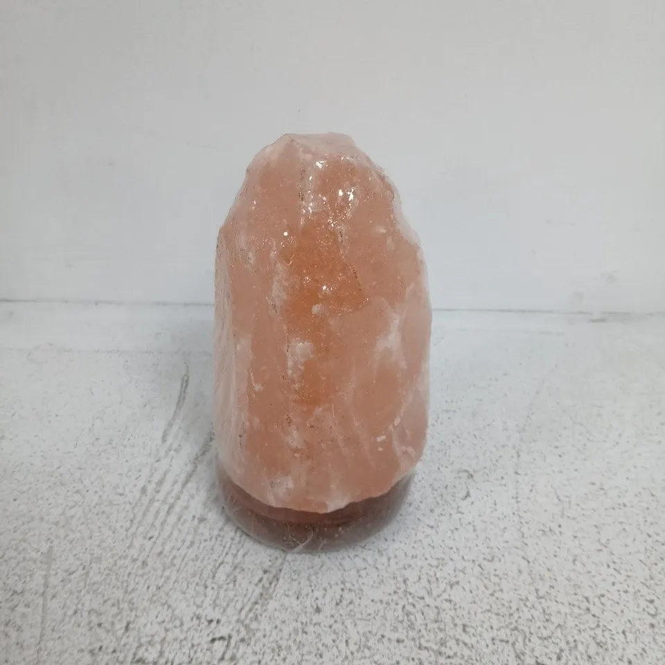 ORANGE HIMALAYAN SALT LAMP ON ROUND WOODEN BASE