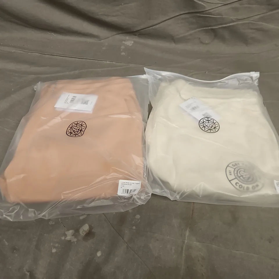 APPROXIMATELY 18 ASSORTED BAGGED CLOTHING ITEMS IN VARIOUS SIZES TO INCLUDE UNISEX GET YOUR COLD ON JOGGERS IN OFF WHITE & UNISEX BRASS MONKEY JOGGERS IN CORAL