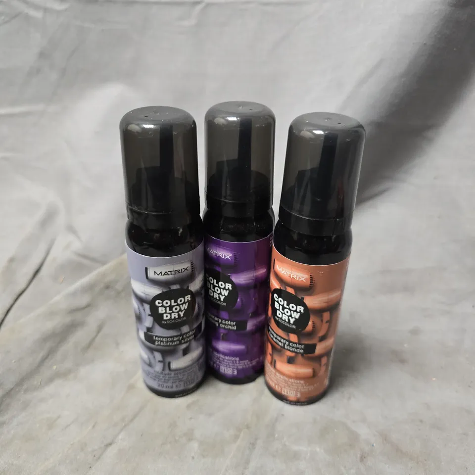 APPROXIMATELY 20 ASSORTED MATRIX BLOW DRY SPRAYS TO INCLUDE CARAMEL BLONDE, BLOOMING ORCHID, PLATINUM SILVER, ETC - COLLECTION ONLY