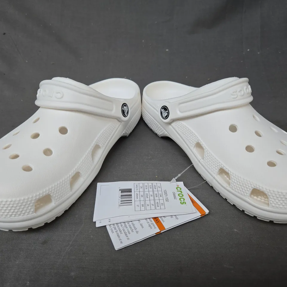 PAIR OF CROCS CLASSIC CLOGS IN MILK WHITE UK SIZE M5/W6