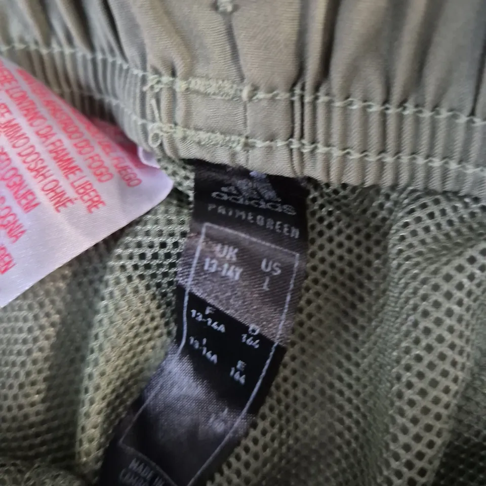 ADIDAS SHORTS – OLIVE GREEN WITH WHITE SIDE STRIPES SIZE 14 YRS