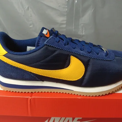 BOXED PAIR OF NIKE CORTEZ TRAINERS IN NAVY/YELLOW - UK 7.5