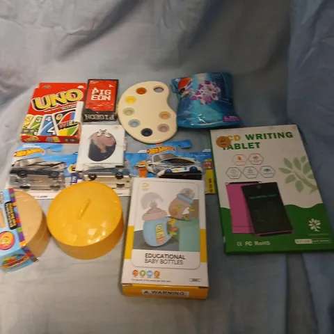 LARGE QUANTITY OF ASSORTED TOYS AND ACCESSORIES TO INCLUDE; MYSTERY DUMPLINGS, UNO, LCD WRITING TABLET, EDUCATIONAL BABY BOTTLES, HOT WHEELS CARS AND PLAYING CARDS