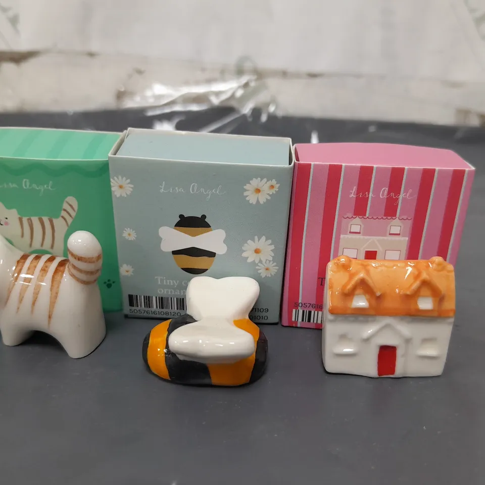 APPROXIMATELY 30 LISA ANGEL CERAMIC TOKENS IN VARIOUS DESIGNS