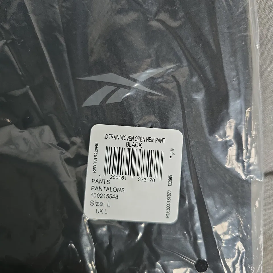 BAGGED REEBOK ID-TRAIN WOVEN OPEN HEM PANT – BLACK, SIZE L