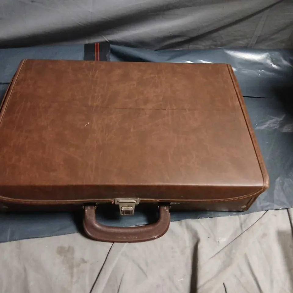 CASETTE CASE WITH APPROXIMATELY 28 ASSORTED CASETTES